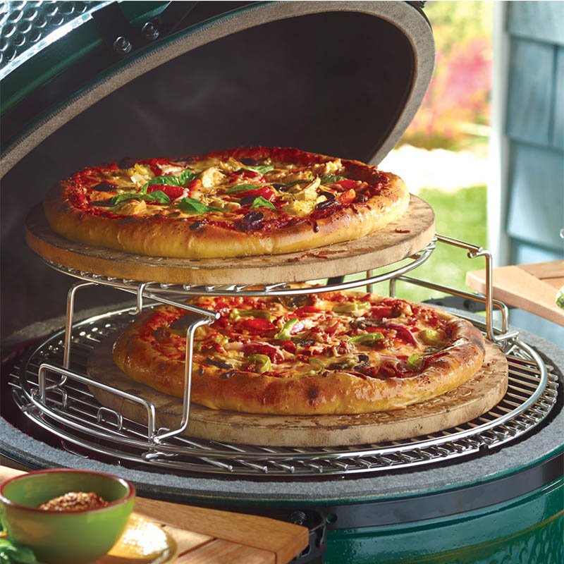 Pizza cooking in ceramic grill